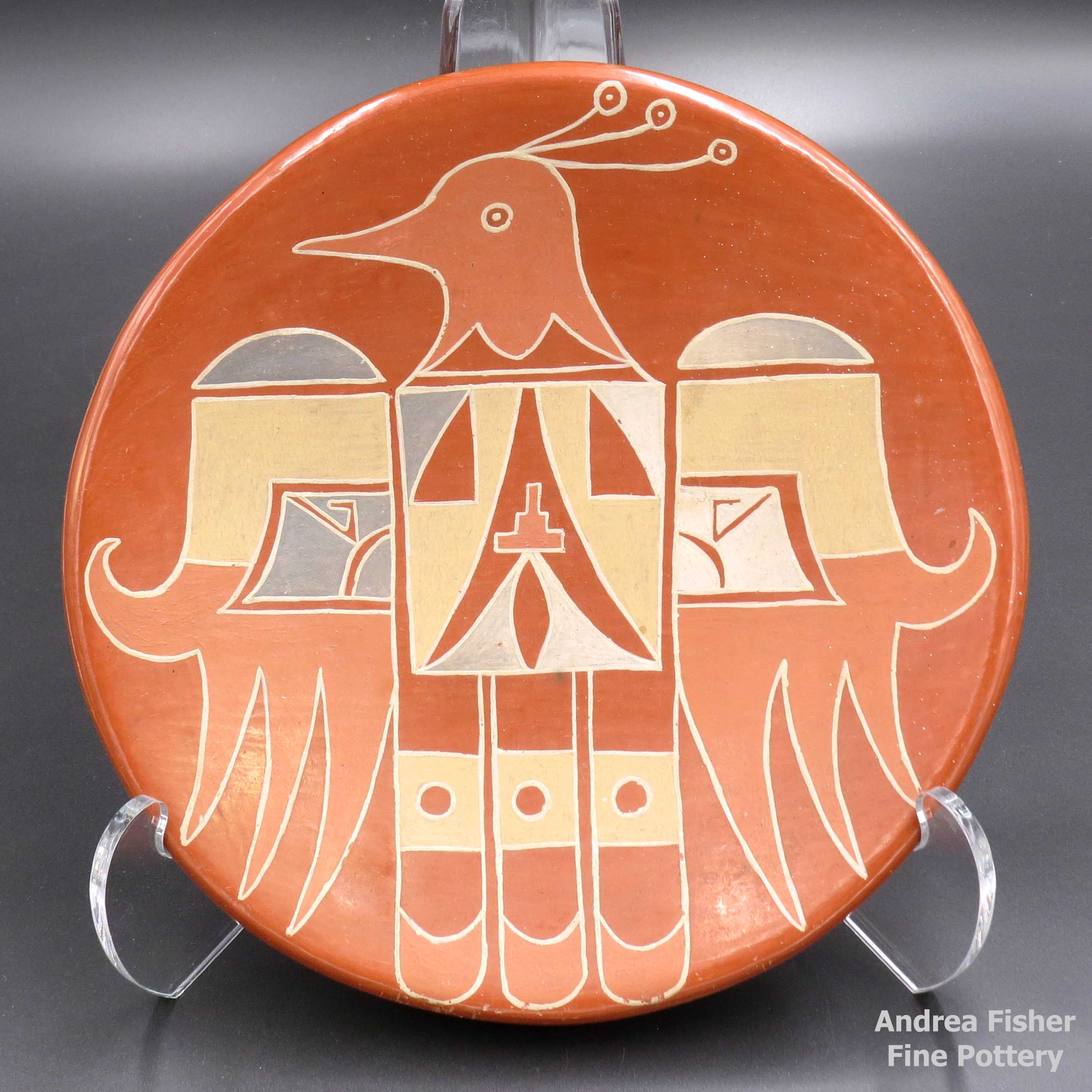 Click or tap to see a larger view Polychrome plate with a thunderbird and geometric design made by Mollie Naranjo of Santa Clara