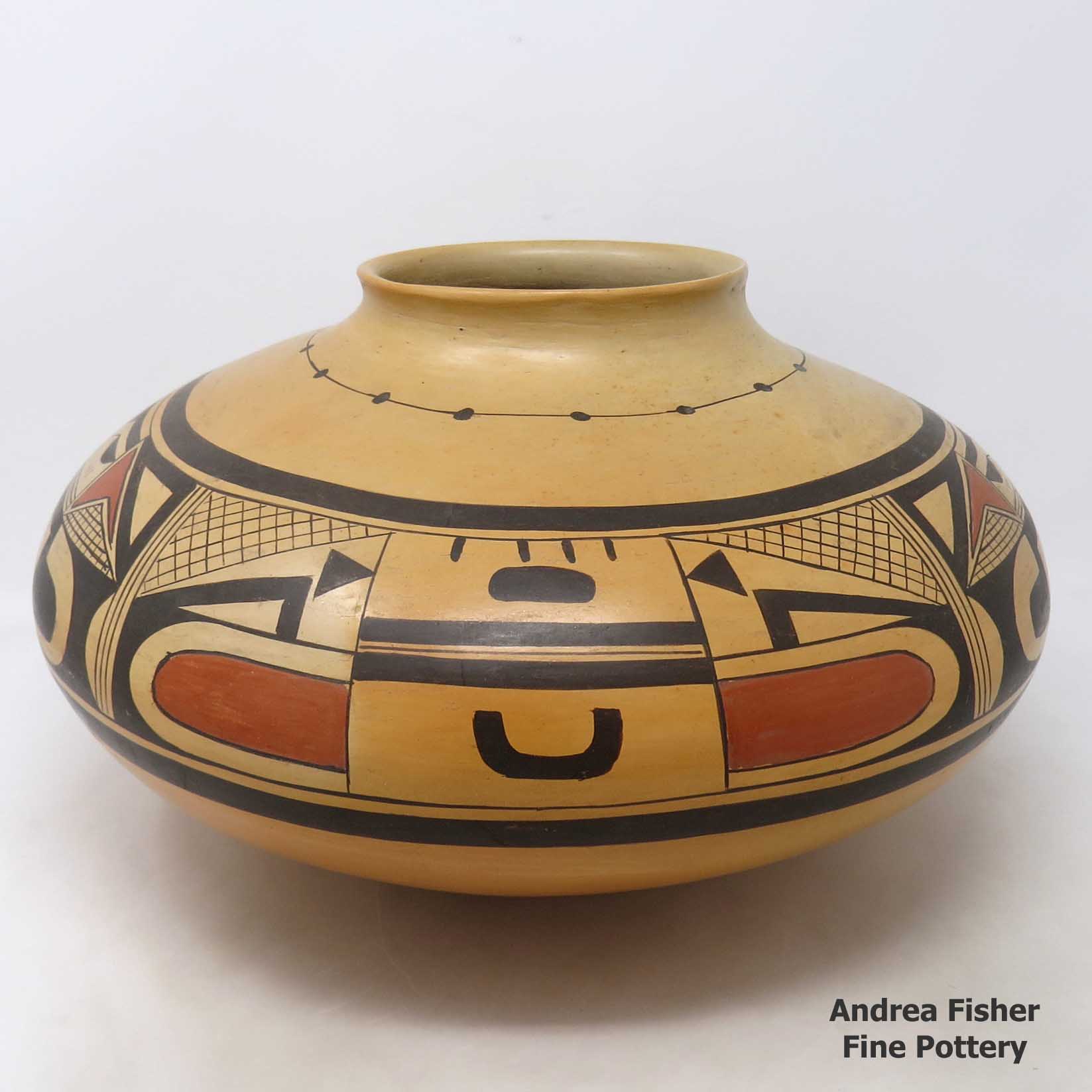 Click or tap to see a larger view Polychrome jar with 4-panel geometric design plus fire clouds
made by Nyla Sahmie of Hopi