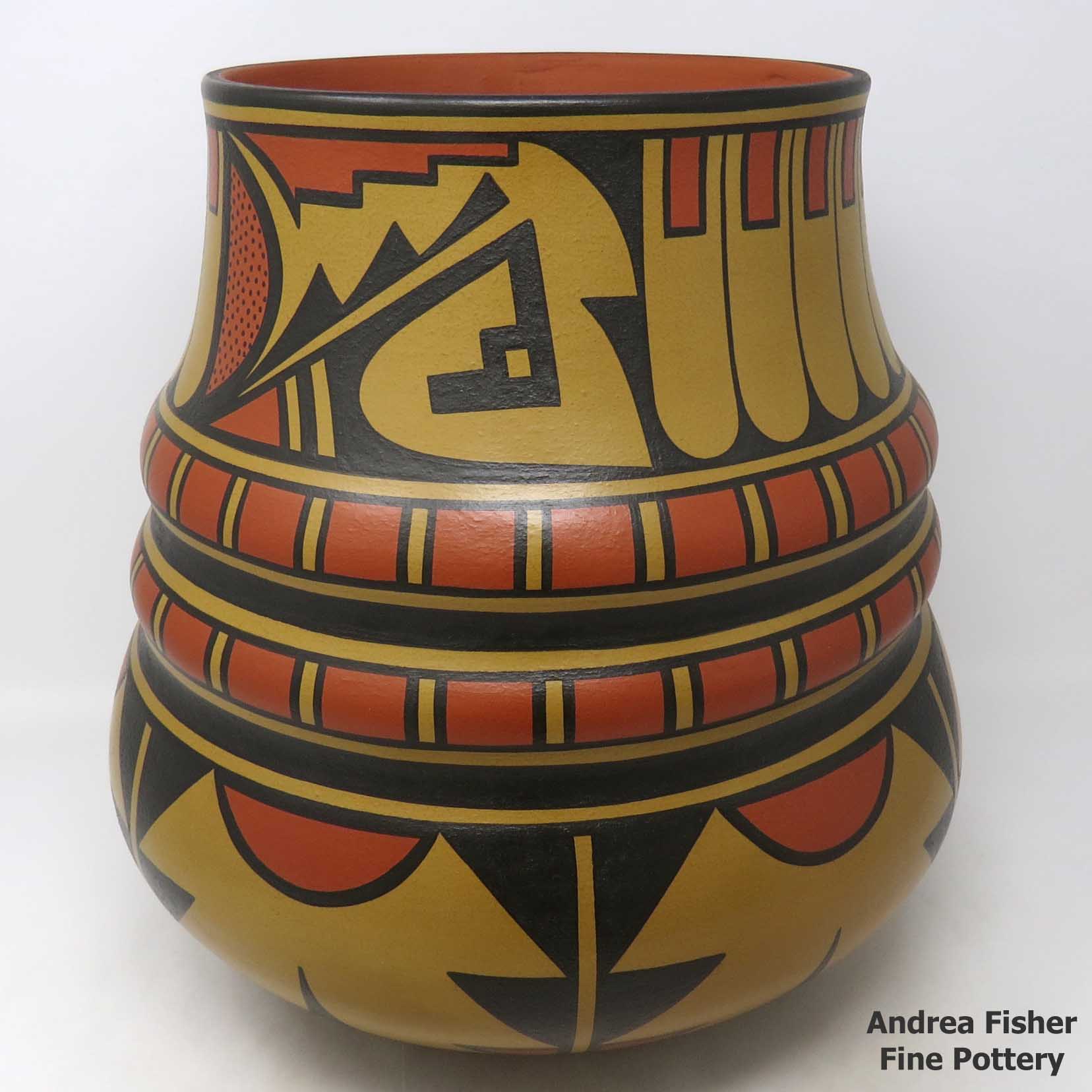 Click or tap to see a larger view Polychrome triple shoulder jar with geometric design
made by Cavan Gonzales of San Ildefonso