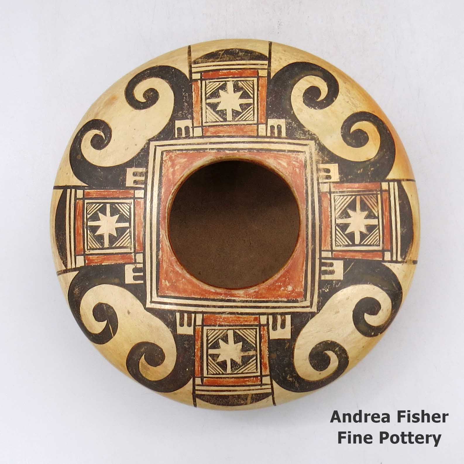 Click or tap to see a larger view Polychrome jar with a geometric design and fire clouds made by Unknown of Hopi