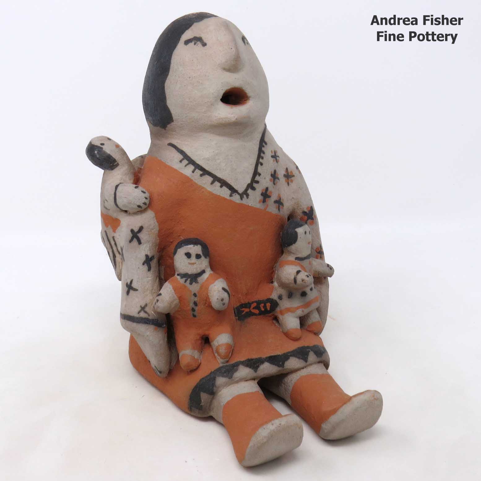 Click or tap to see a larger view Grandmother storyteller with 3 children
made by Josephine Arquero of Cochiti