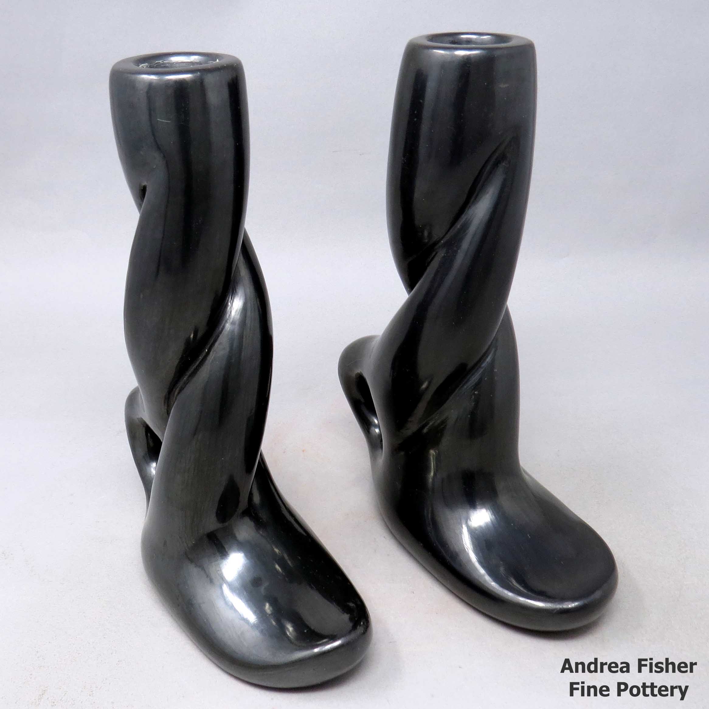 Click or tap to see a larger view A pair of carved, twisted black candlestick holders
made by Margaret Tafoya of Santa Clara