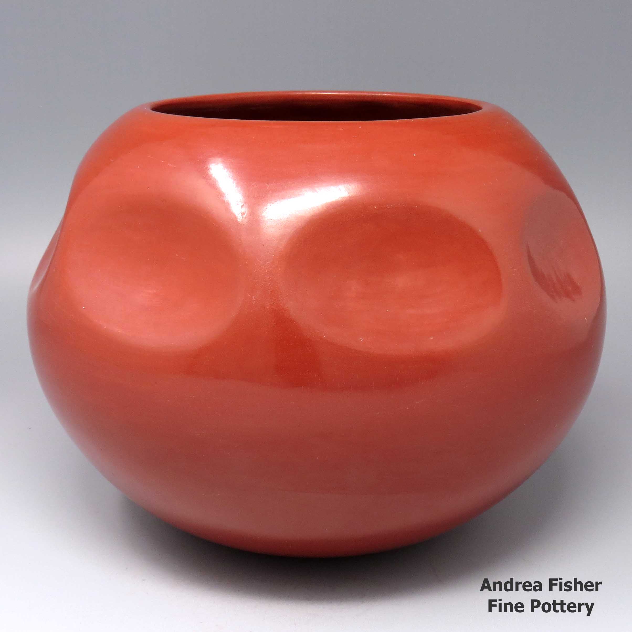 Click or tap to see a larger view Red jar with 7 equally spaced impressions above the shoulder
made by Tina Garcia of Santa Clara