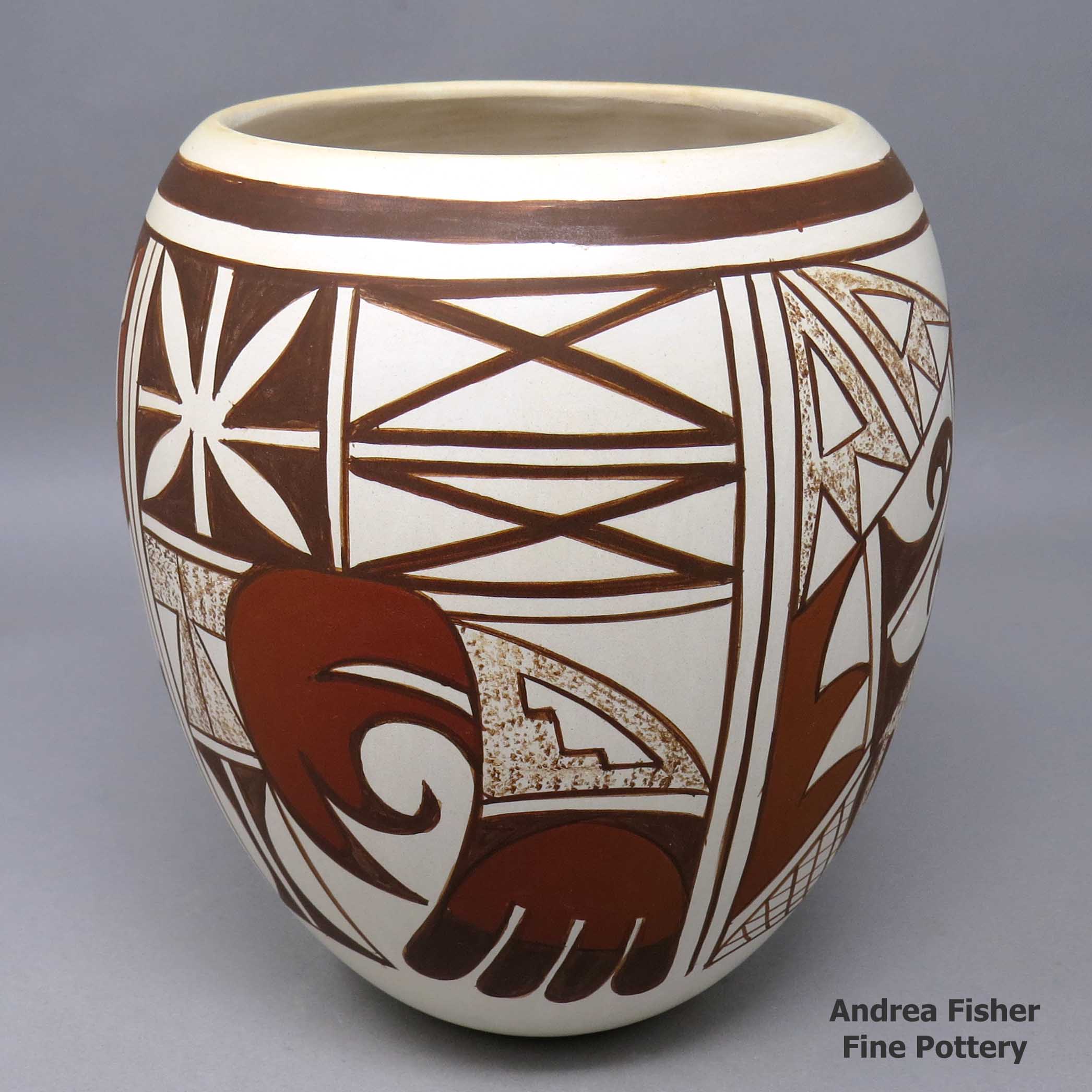 Click or tap to see a larger view Polychrome jar with 4-panel bird element and geometric design made by Loretta Navasie of Hopi