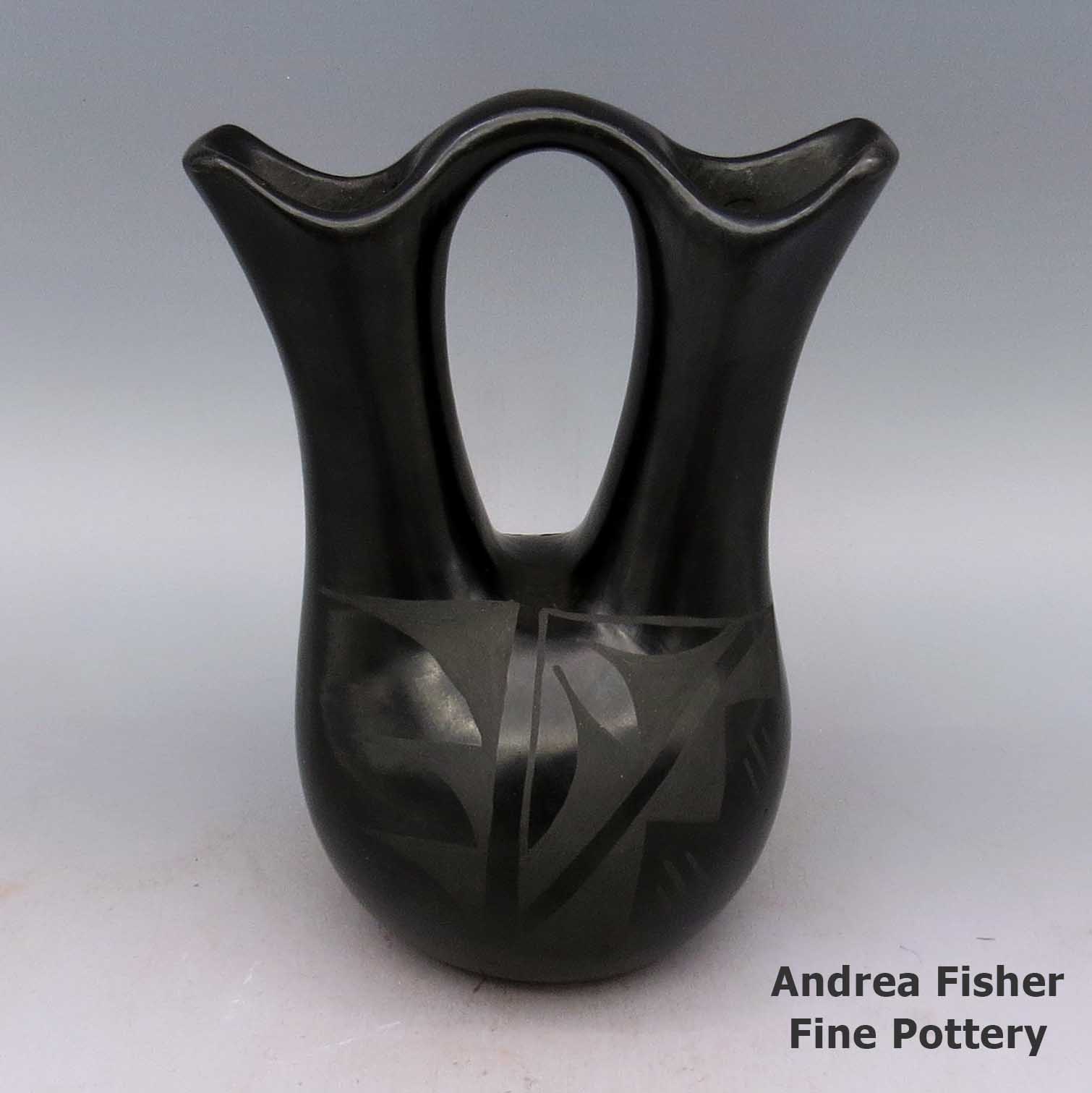 Black-on-black wedding vase decorated with a geometric design made by Unknown of Santa Clara