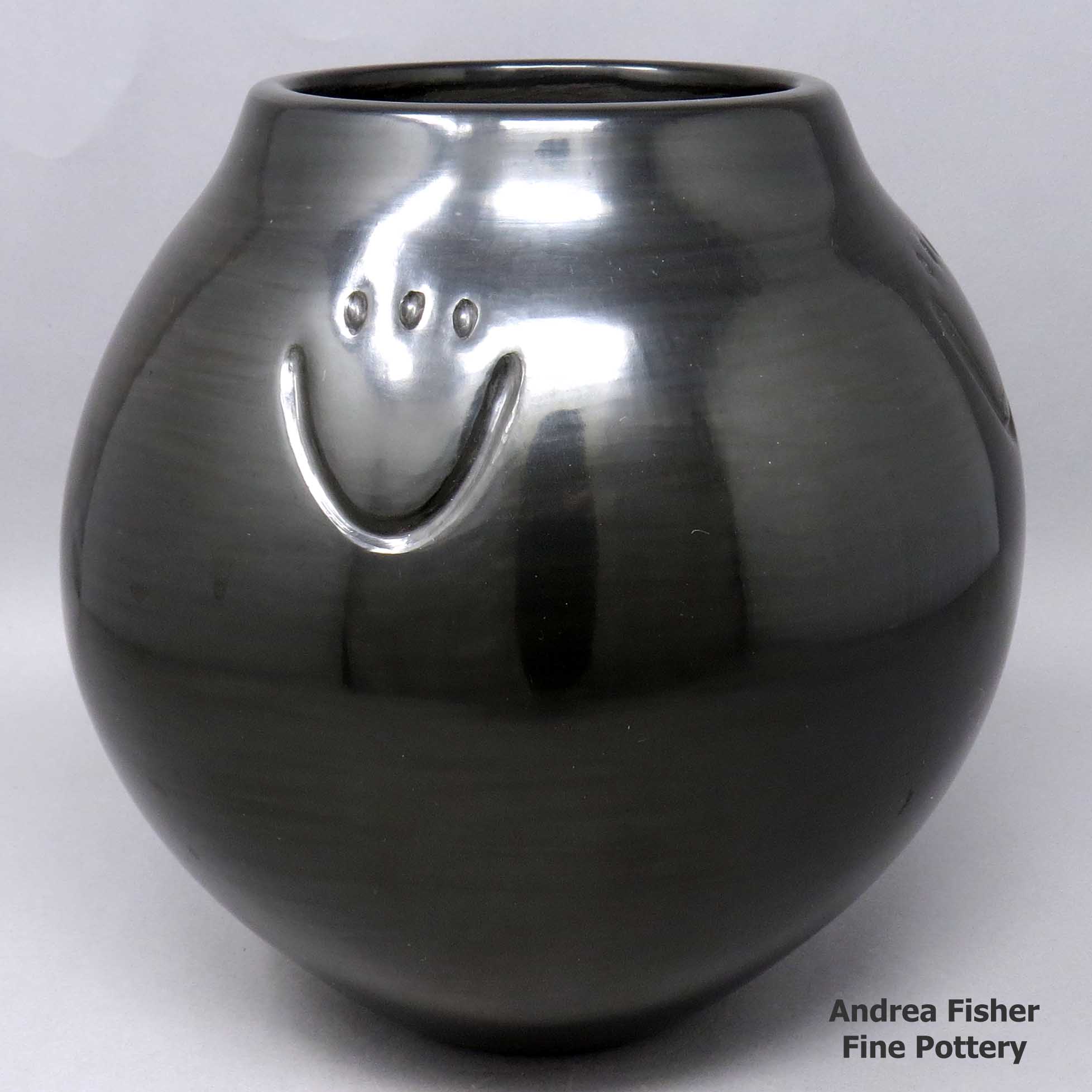Click or tap to see a larger view Black jar with 4 bear paw imprints made by Toni Roller of Santa Clara