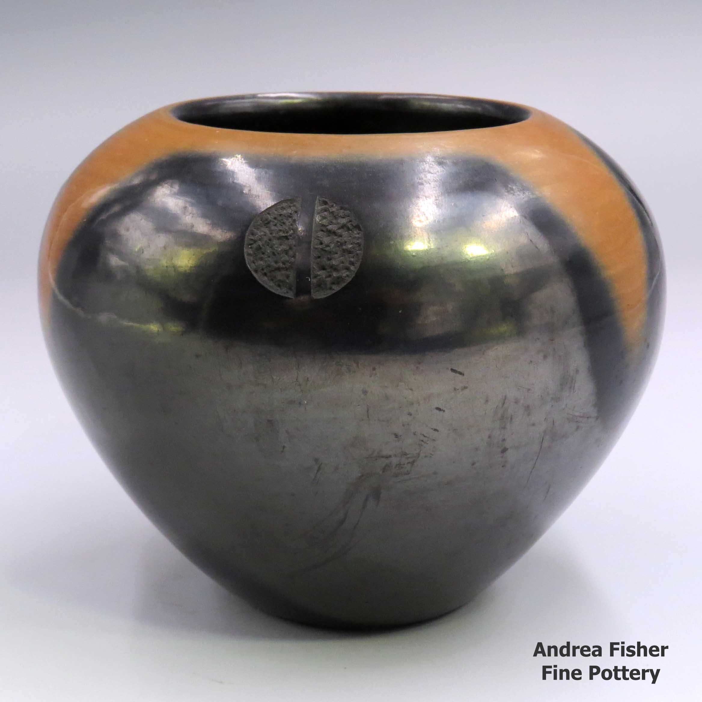 Click or tap to see a larger view Gunmetal black jar with sienna rim and 3 sgraffito deer prints made by Tony Da of San Ildefonso