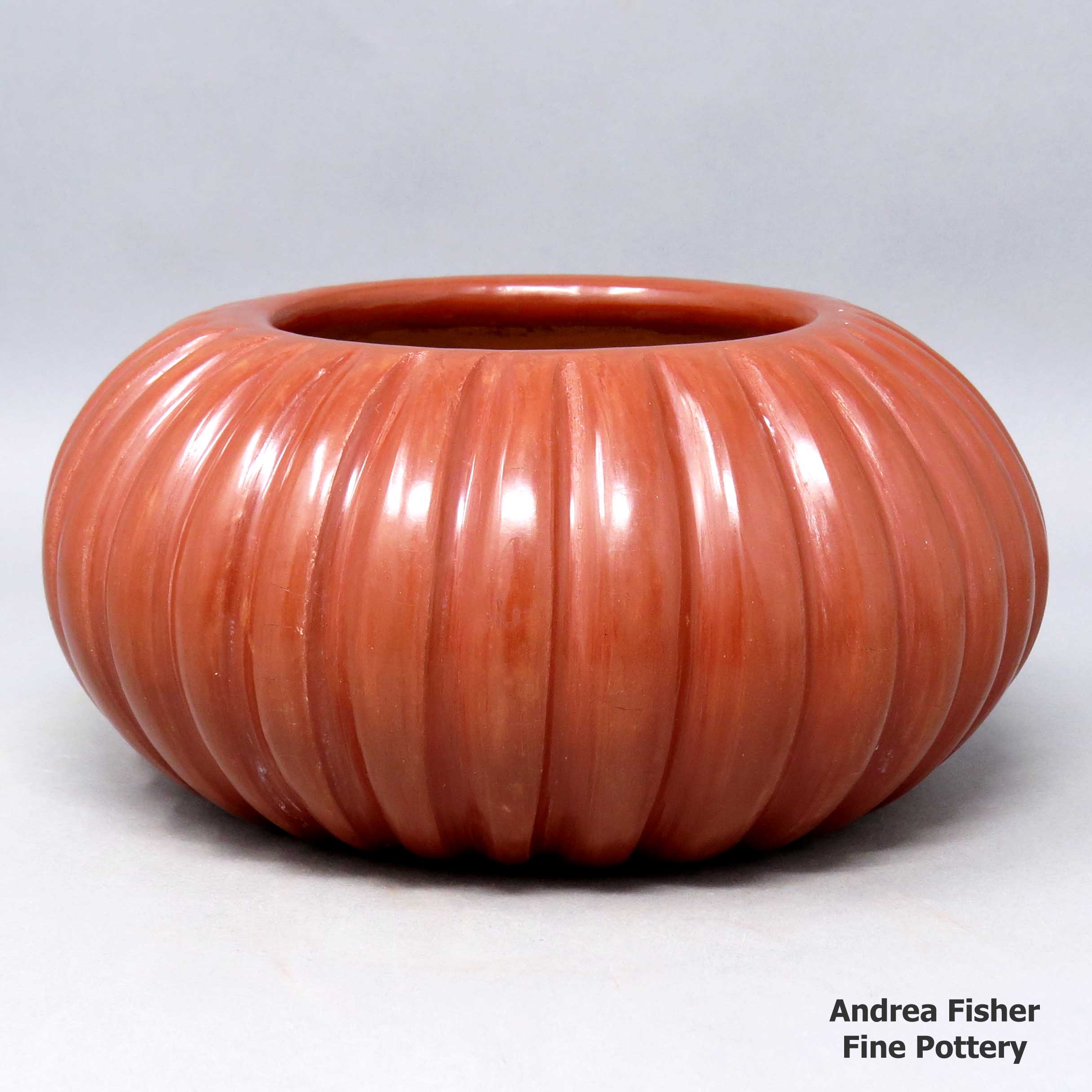 Click or tap to see a larger view Carved red melon bowl made by Angela Baca of Santa Clara