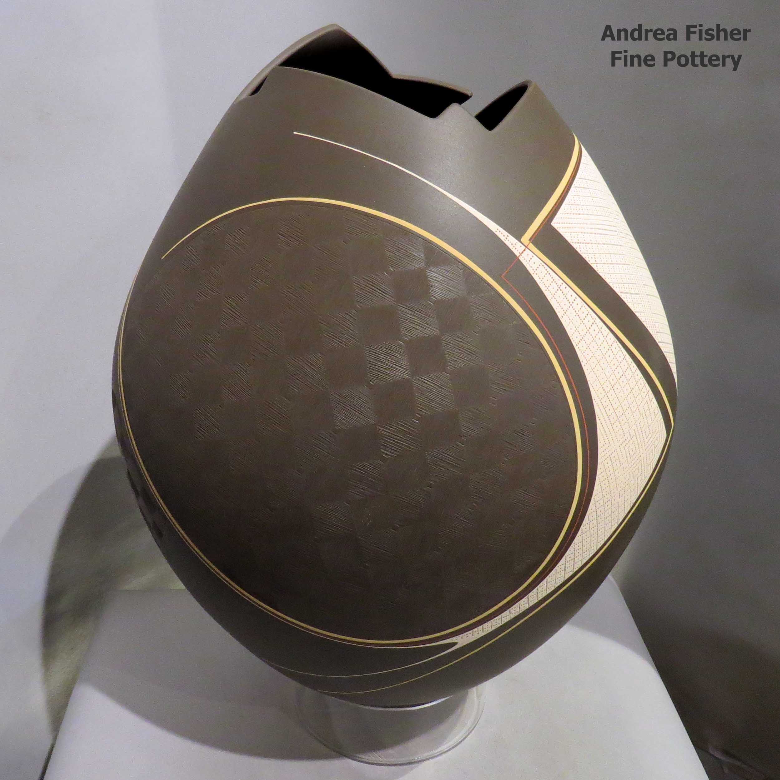 Diego Valles created this piece Polychrome jar with geometric opening and sgraffito texture and painted geometric design