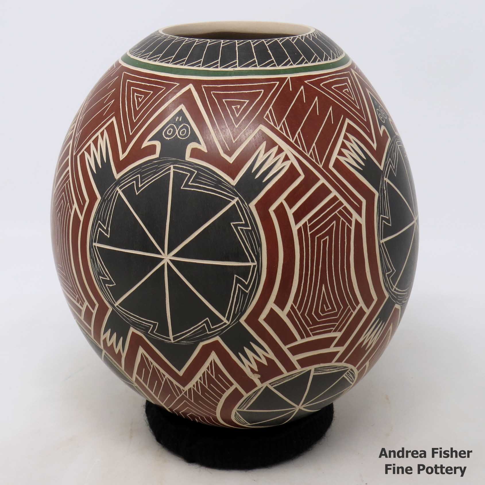 Click or tap to see a larger view Polychrome jar with sgraffito and painted turtle, medallion and geometric design
made by Humberto Pina of Mata Ortiz and Casas Grandes