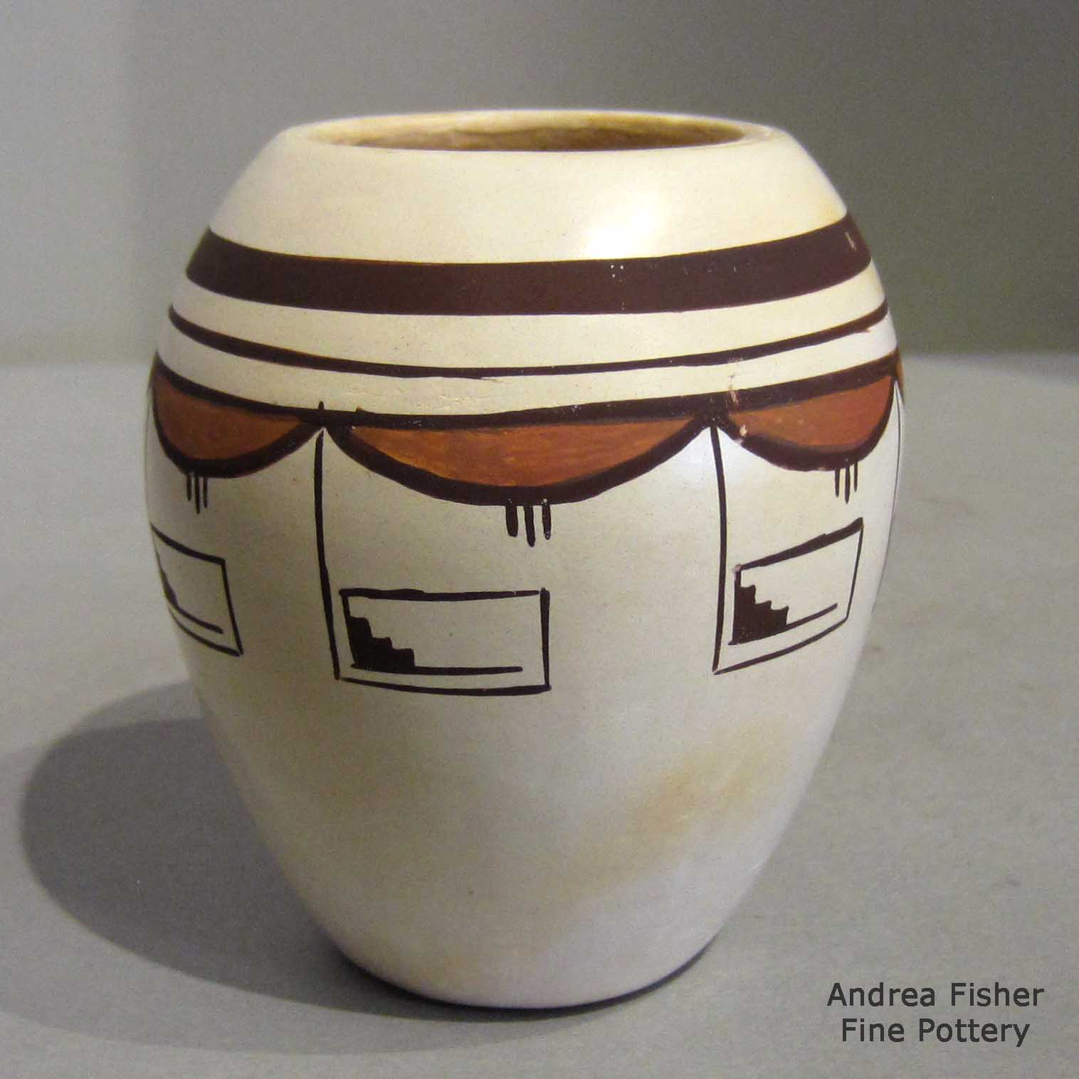 Fawn Navasie created this piece Polychrome white ware jar with geometric design