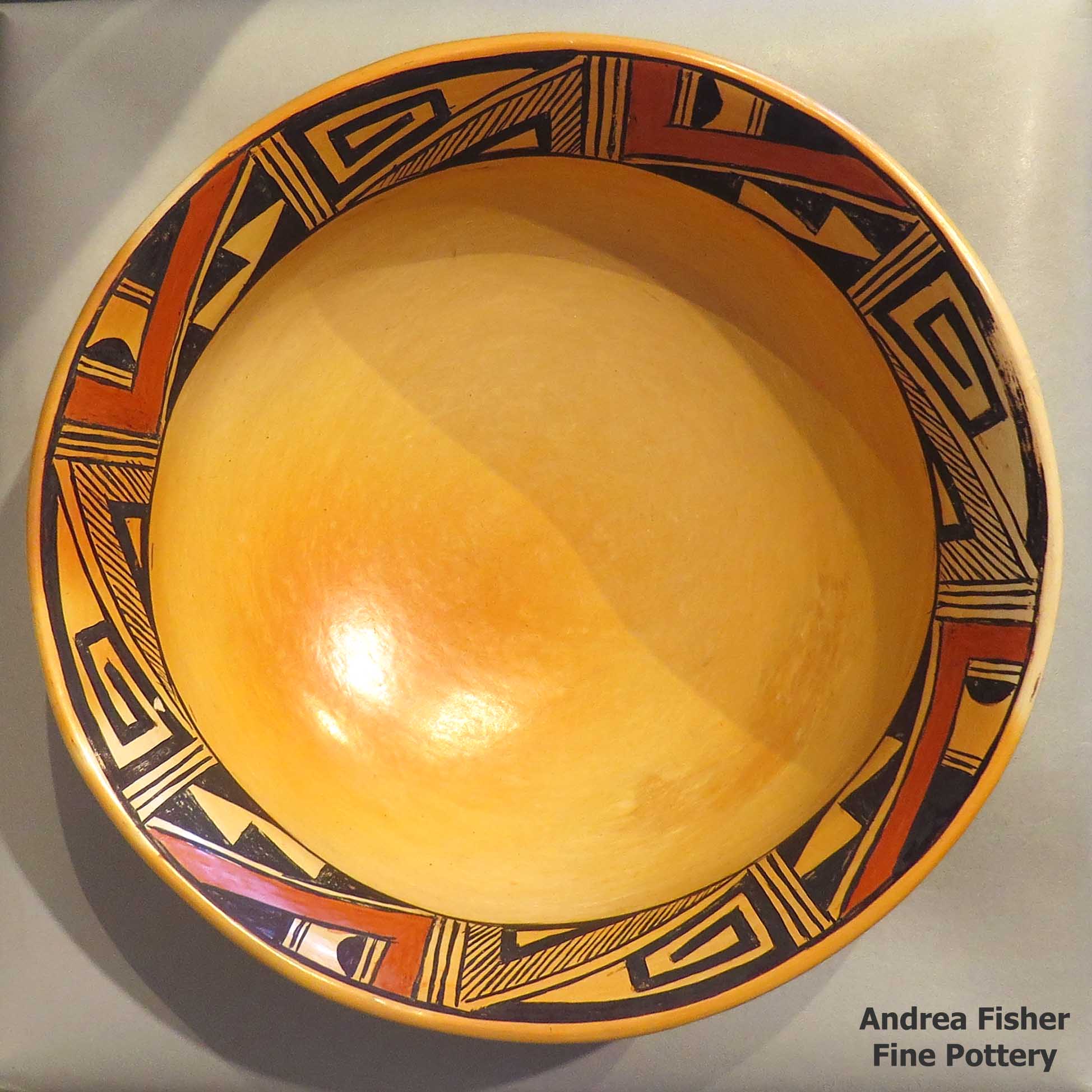 Click or tap to see a larger view Polychrome bowl with band of geometric design inside and fire clouds inside and out made by Nancy Lewis of Hopi