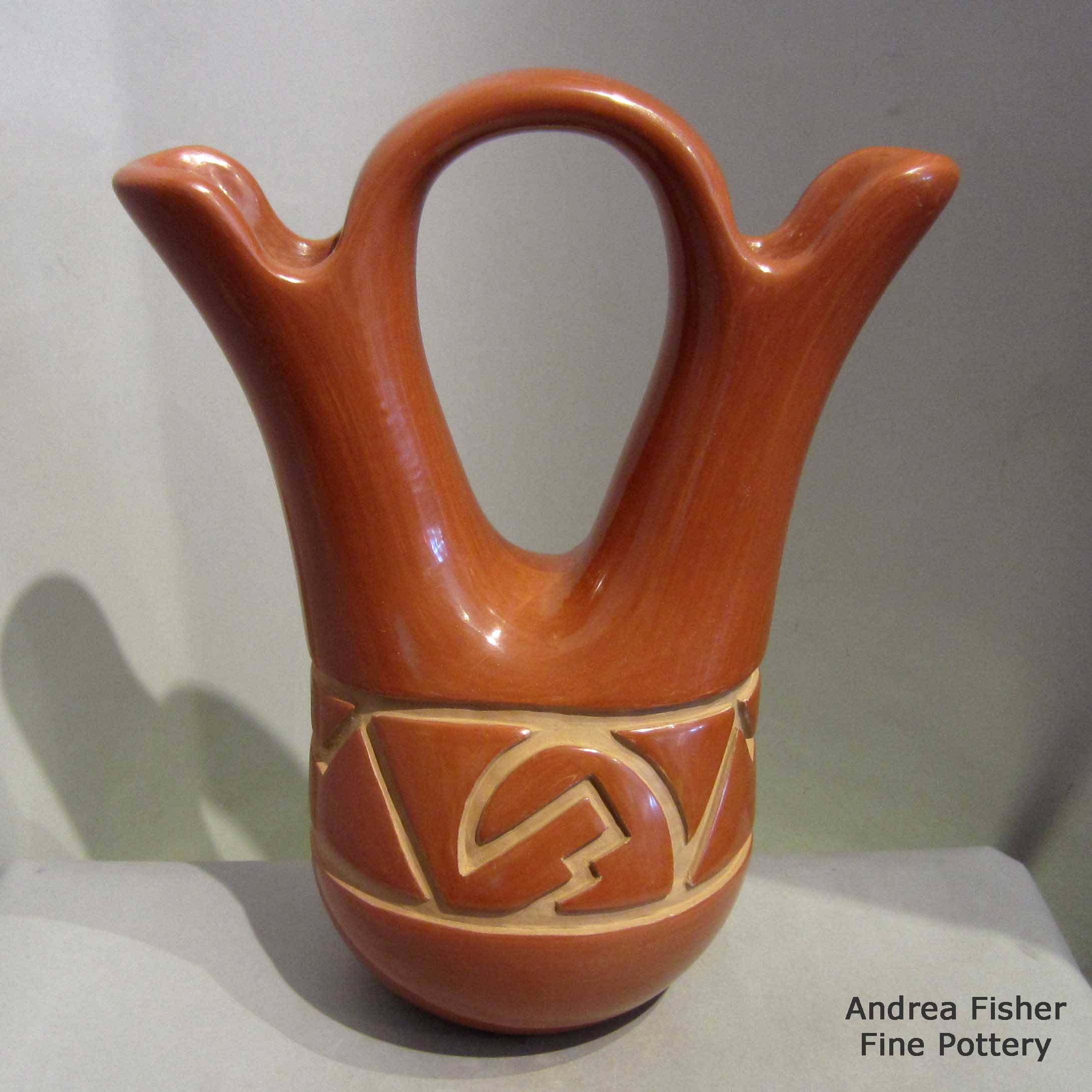 Click or tap to see a larger view Red wedding vase carved with geometric design made by LuAnn Tafoya of Santa Clara