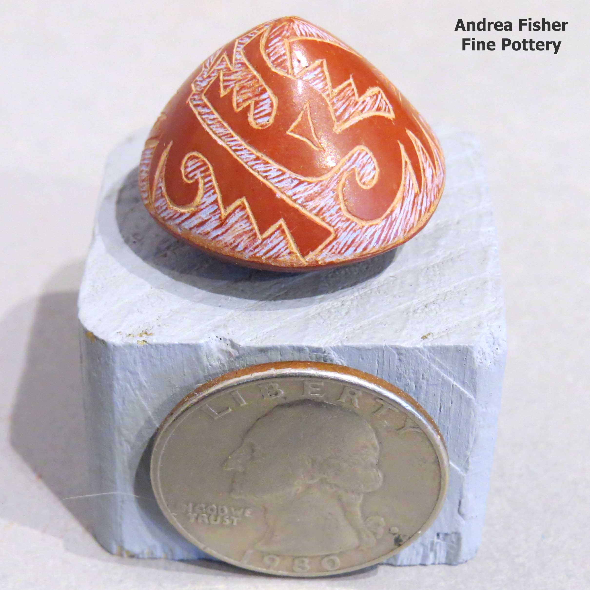 Rosemary Lonewolf created this piece Miniature polychrome seed pot with sgraffito and painted avanyu and geometric design