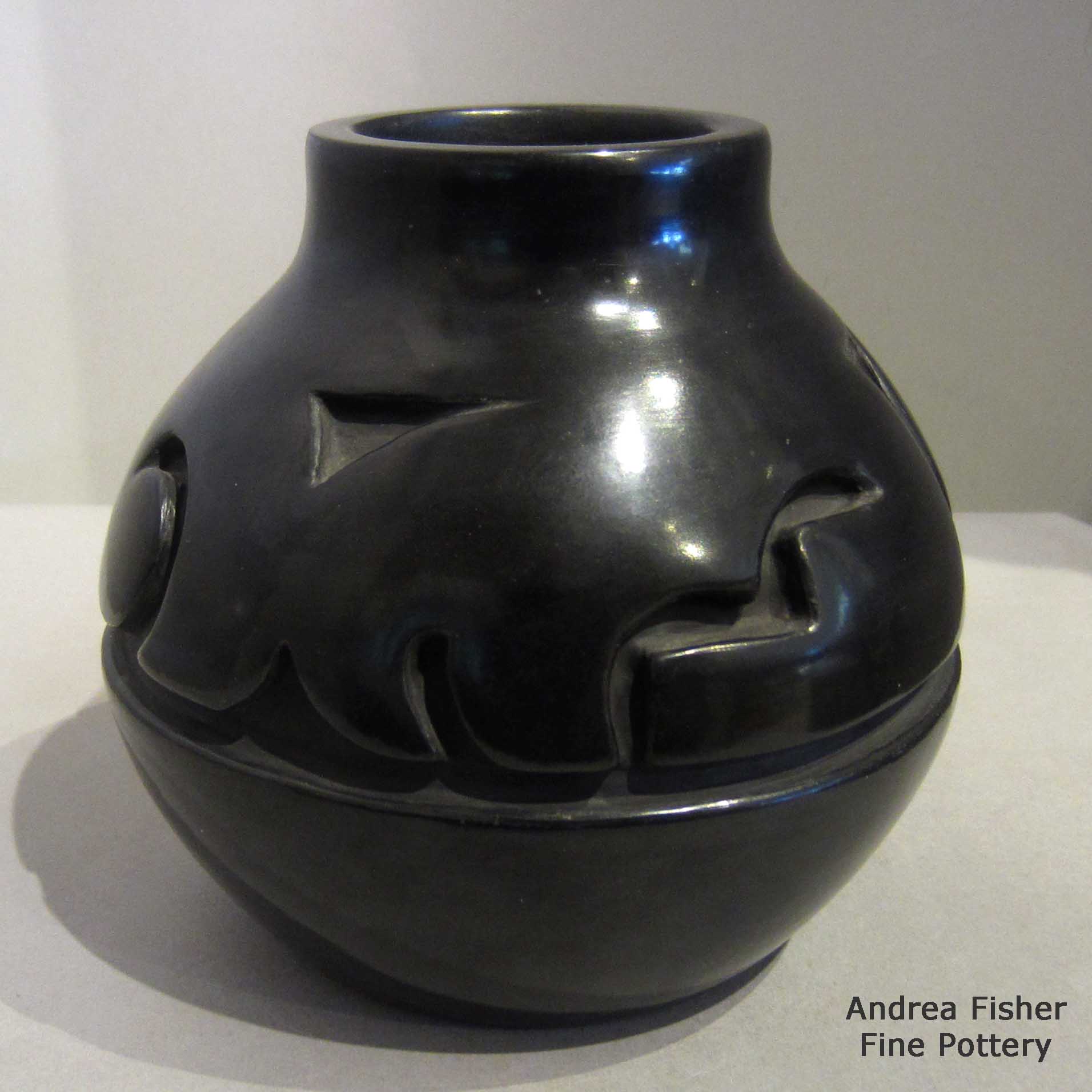 Click or tap to see a larger view Black jar carved with geometric design made by Mela Youngblood of Santa Clara