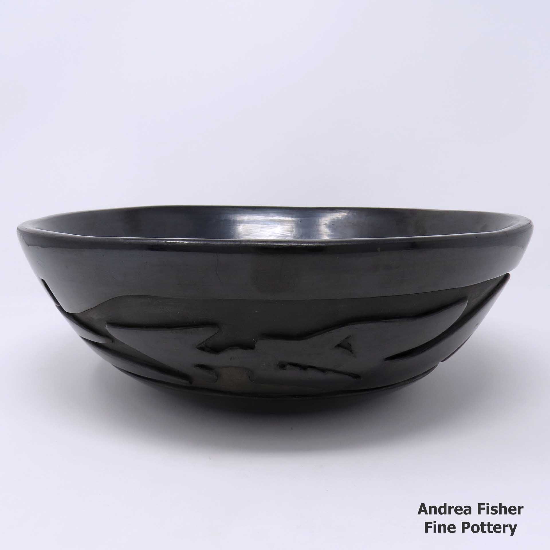 Click or tap to see a larger view Black bowl carved with an avanyu design made by Christina Naranjo of Santa Clara