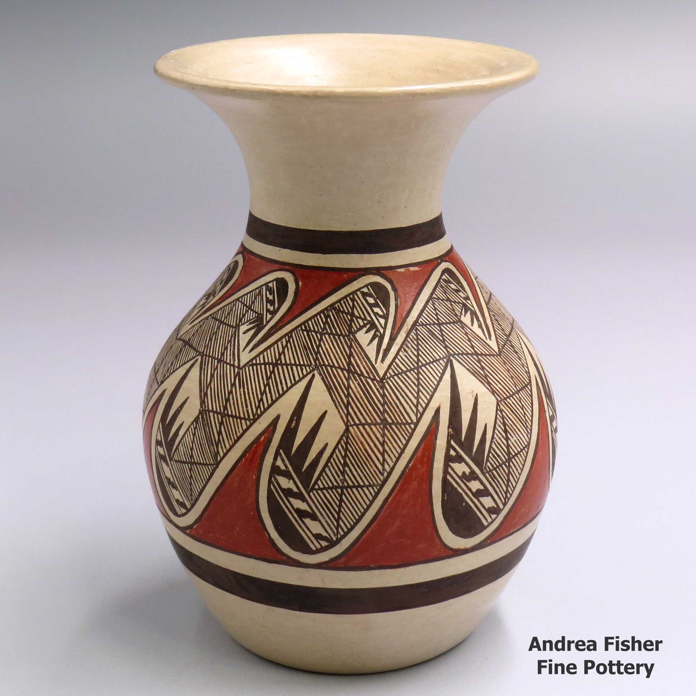 Click or tap to see a larger view Polychrome jar with a flared opening and a migration pattern design made by Tonita Nampeyo of Hopi