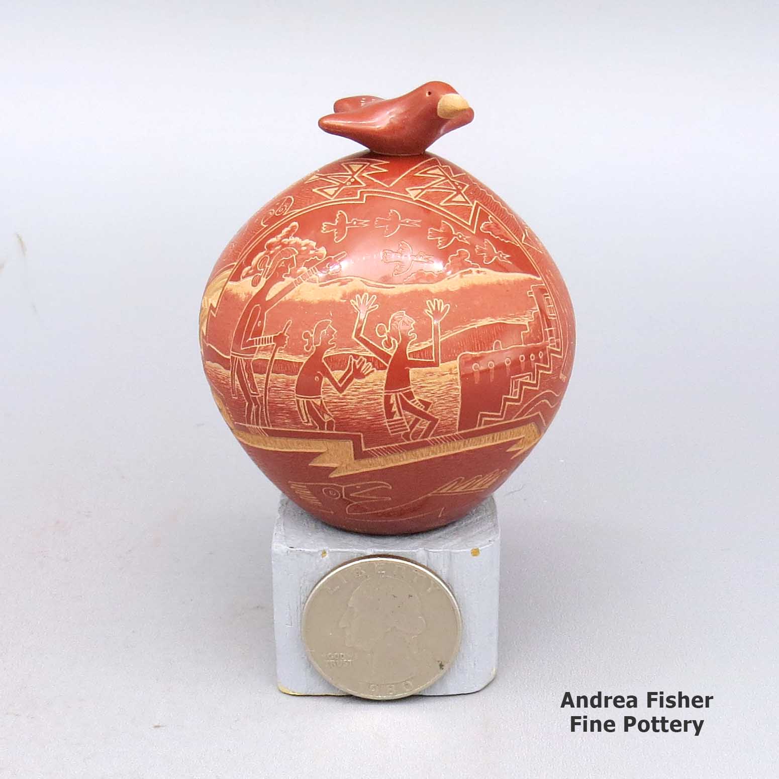 Miniature red lidded jar with sgraffito people, pueblo, Mimbres bird, and geometric design, with matching bird lid made by Susan Romero of Santa Clara