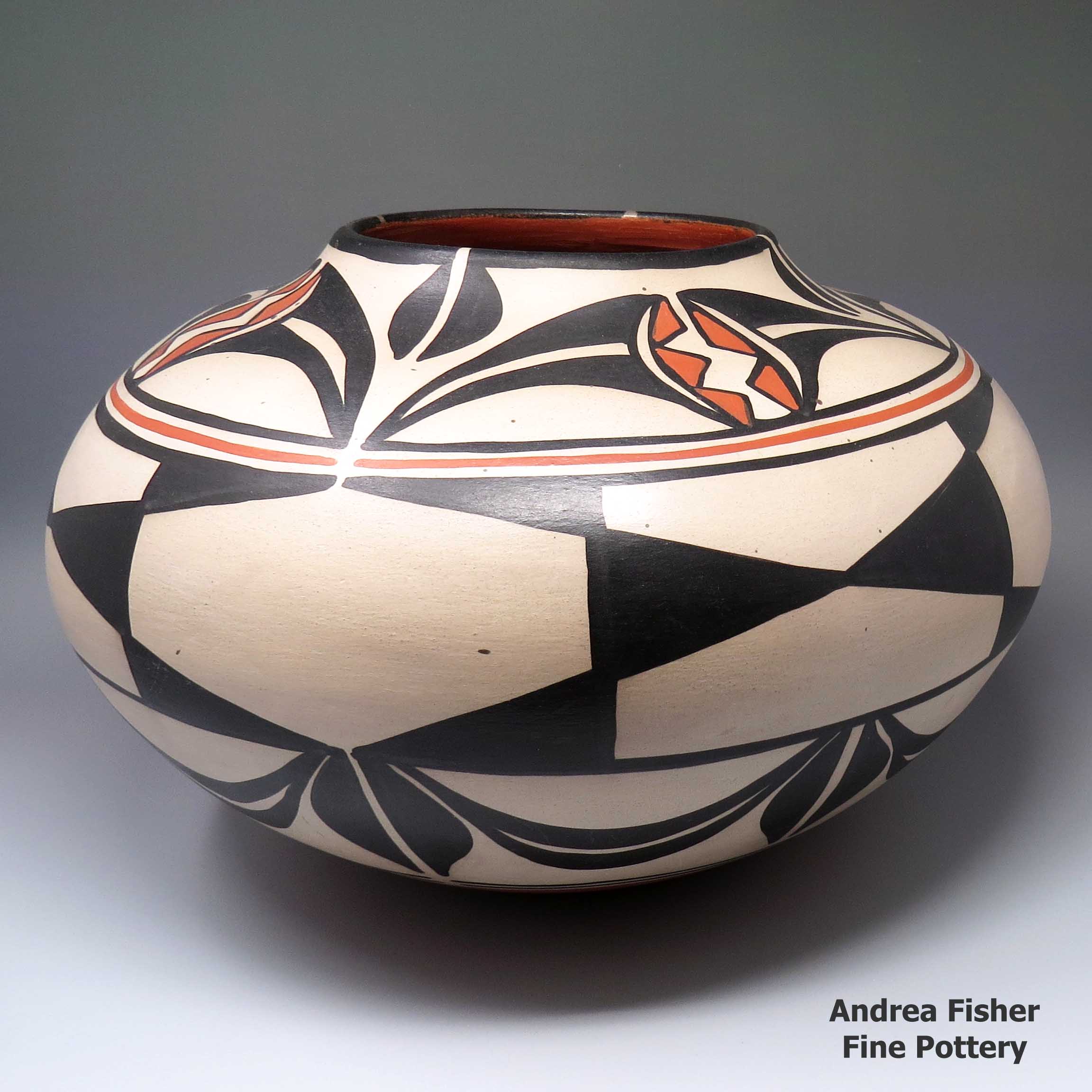 Click or tap to see a larger view Polychrome jar with fish design inside, geometric design outside made by Robert Tenorio of Santo Domingo
