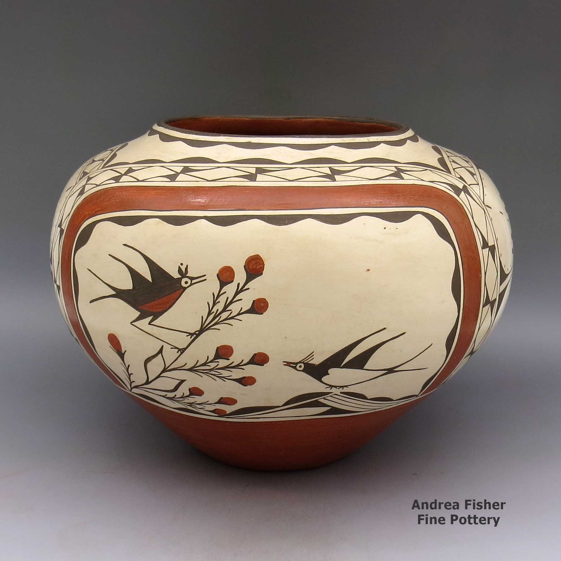 Polychrome jar with a bird, berry, branch, and geometric design made by Kathy Pino of Zia