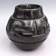 Black jar carved with geometric design
 by Virginia Ebelacker of Santa Clara