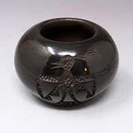 Black jar with carved bird design
 by Irene Tse Pe of San Ildefonso