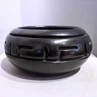 Black jar carved with a geometric design
 by Margaret Tafoya of Santa Clara