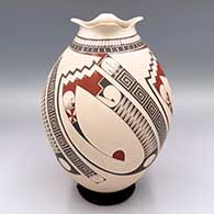 Polychrome jar with a sgraffito and painted 4-panel geometric design plus a rolled flower petal lip
 by Roberto Olivas of Mata Ortiz and Casas Grandes