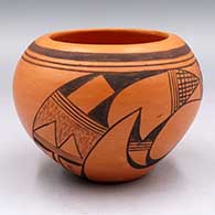 Black-on-red bowl with a 2-panel bird element and geometric design
 by Eleanor Ami of Hopi
