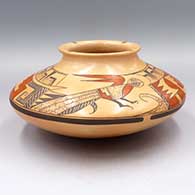 Polychrome jar with a flared lip and decorated with a parrot and geometric design above the shoulder and with ticks on the rim
 by Jean Sahmie of Hopi