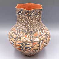 Polychrome jar with fluted neck and bands of cornstalk, pumpkin seed snowflake, feathers and geometric design
 by Ben and Geraldine Toya of Jemez