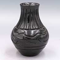 Black water jar carved with an avanyu and geometric design
 by Stella Chavarria of Santa Clara