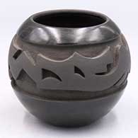 Black-on-black jar carved with an avanyu design around the shoulder
 by Marvin Moquino of Santa Clara