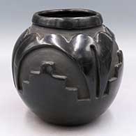 Black jar carved around the body with a 4-panel kiva step and geometric design
 by Christina Naranjo of Santa Clara