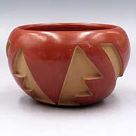 Red bowl carved with a 4-panel geometric design
 by Anita Suazo of Santa Clara