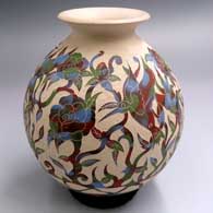 Polychrome jar with a rolled lip and a slipped and sgraffito bird, branch and flower design
 by Diana Loya of Mata Ortiz and Casas Grandes