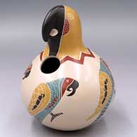 Polychrome parrot effigy jar with a sgraffito and painted parrot and geometric design
 by Vidal Corona of Mata Ortiz and Casas Grandes