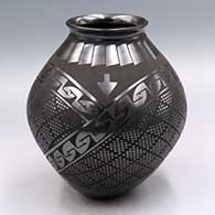 Black-on-black jar with a flared lip and a 3-panel cuadrillo and geometric design
 by Ismael Sandoval of Mata Ortiz and Casas Grandes