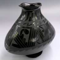 Oval black-on-black jar with a flared square lip and painted geometric design
 by Socorro Reyes of Mata Ortiz and Casas Grandes