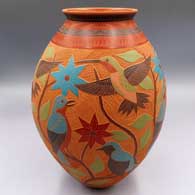 Polychrome jar with a sgraffito and painted 4-panel bird, branch, flower and geometric design
 by Jesus Olivas of Mata Ortiz and Casas Grandes
