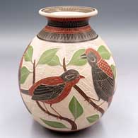 Polychrome jar with a rolled lip and a sgraffito and painted 3-panel bird, branch, leaf and geometric design
 by Jesus Olivas of Mata Ortiz and Casas Grandes