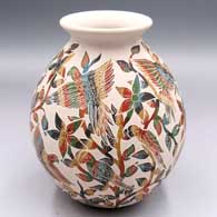 Polychrome jar with a rolled lip and a sgraffito and painted parrot, branch, flower and geometric design
 by Karina Mora of Mata Ortiz and Casas Grandes
