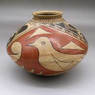 A Ramos Polychrome jar with a rolled lip, a three-panel bird and geometric design and a band of corrugation around the neck
 by Consolacion Quezada of Mata Ortiz and Casas Grandes
