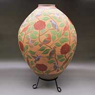 Large polychrome jar with a sgraffito and painted bird, rose, branch, leaf, and geometric design
 by Jesus Olivas of Mata Ortiz and Casas Grandes
