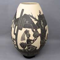 Black and white jar with sgraffito Aztec family yard design
 by Humberto Guillen Rodriguez of Mata Ortiz and Casas Grandes