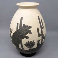 Black and white jar with sgraffito hunter, nature and geometric design
 by Humberto Guillen Rodriguez of Mata Ortiz and Casas Grandes