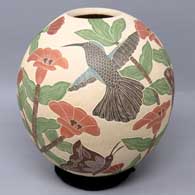 Polychrome jar with sgraffito and painted bird, butterfly, branch and flower design
 by Karla Flores of Mata Ortiz and Casas Grandes