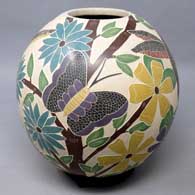 Polychrome sgraffito and painted bird, butterfly, flower and branch design
 by Karla Flores of Mata Ortiz and Casas Grandes