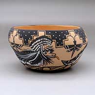 Click for a larger view A polychrome bowl decorated with a kolowisi, dragonfly, tadpole, kiva step and geometric design
by Daryl Westika of Zuni