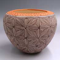 Polychrome jar with a corrugated red rim and black-on-white fine line snowflake design
 by Juana Leno of Acoma